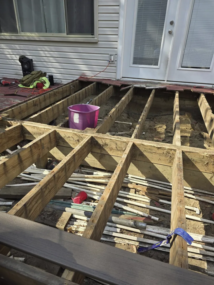 Old deck torn down to subframe before deck renovation Metro Detroit