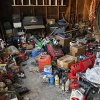 Cluttered garage before junk removal cleanout Detroit Metro