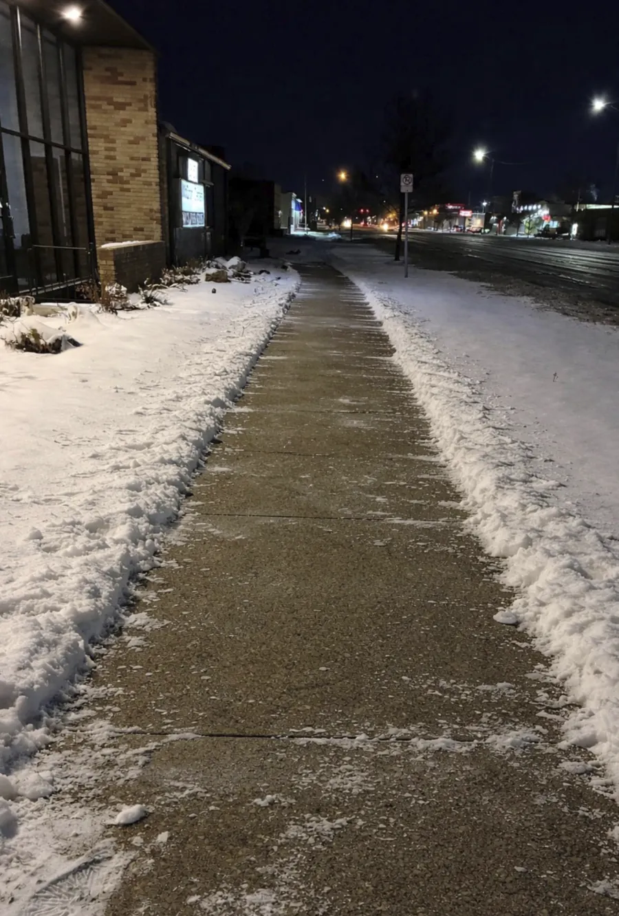 Cleared sidewalk after snow removal service Metro Detroit