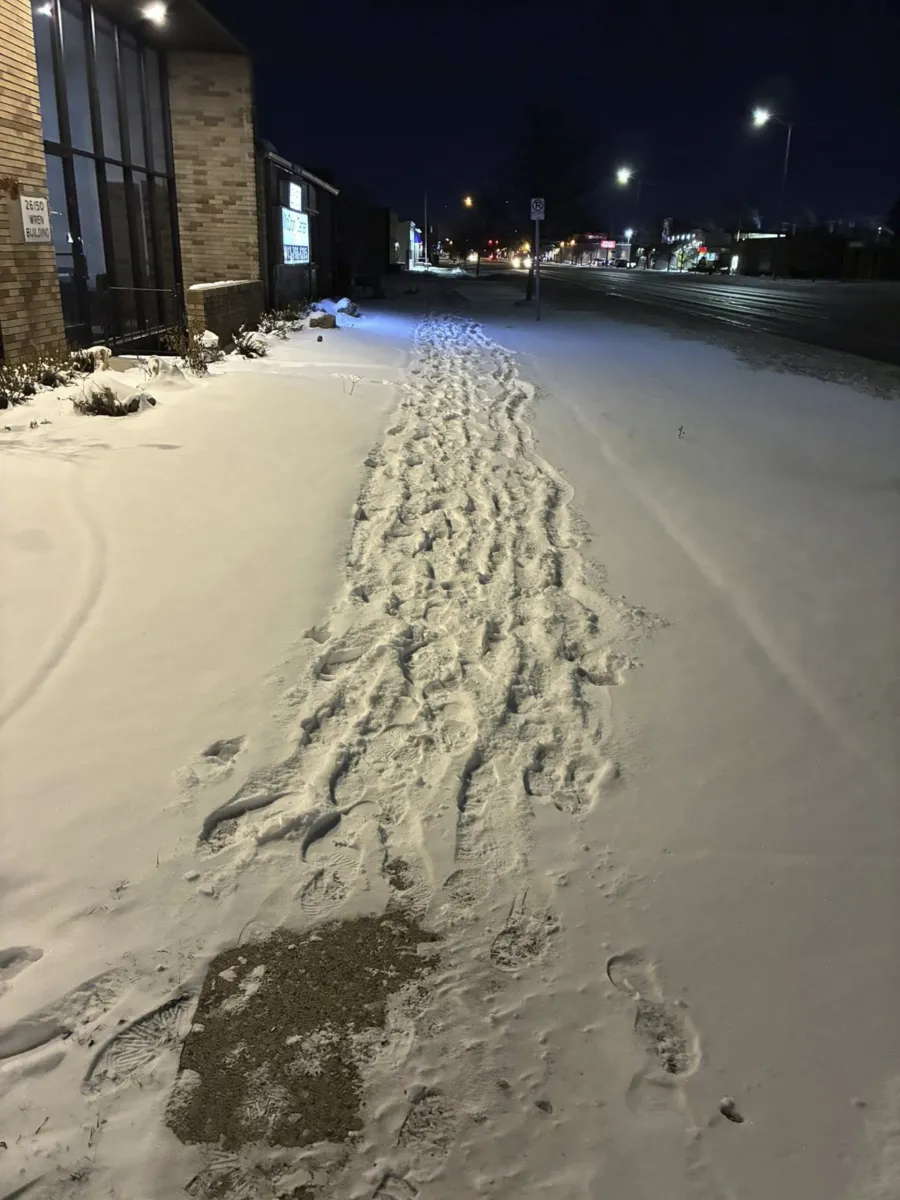Snow-covered sidewalk before snow removal service Detroit